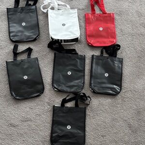 set of lululemon athletica Black, White, and Red reusable Tote Bags